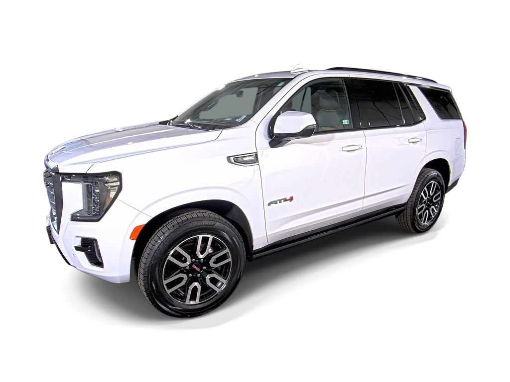 2023 GMC Yukon AT4 in Summit White — front three-quarter view