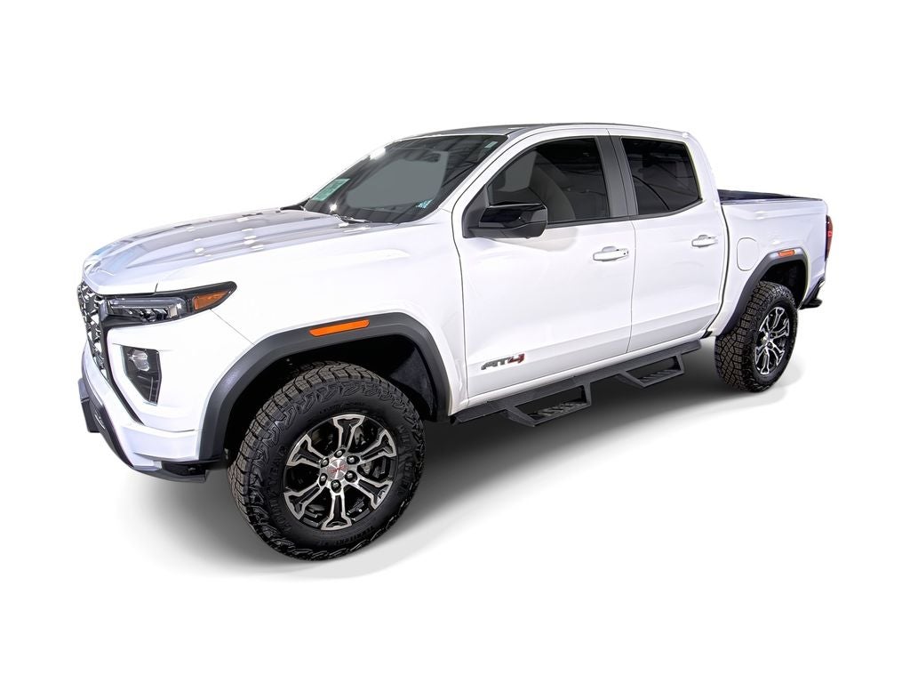 2024 GMC Canyon AT4 in Summit White — front three-quarter view