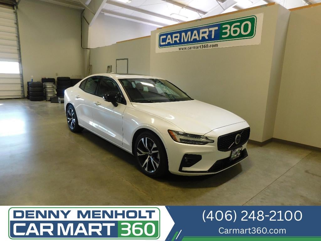 2024 Volvo S60 Plus Dark Theme AWD in Crystal White Metallic — front three-quarter view
